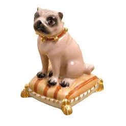 Scully & Scully Fawn Pug Sitting On Brown Pillow